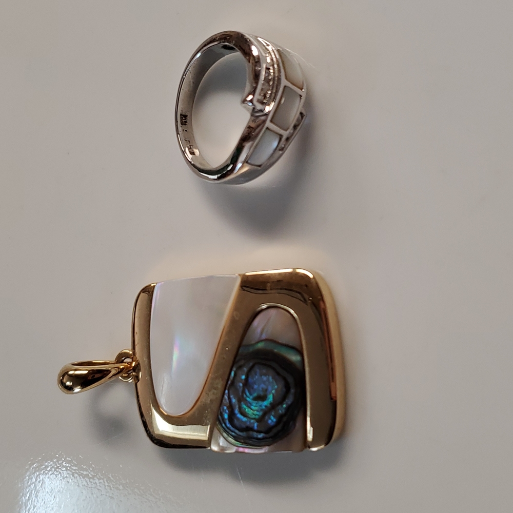 Lia sophia pendant in gold tone and ring in silver. Sold together for $45